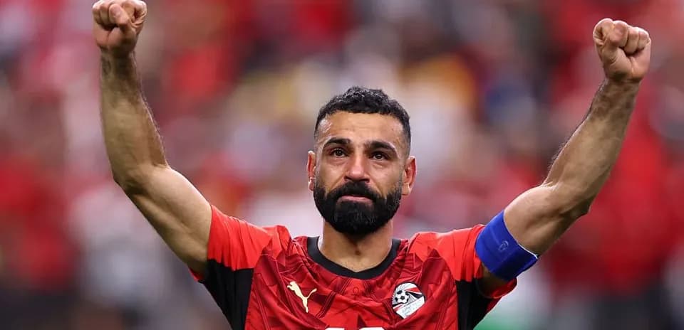 Player celebrating with raised arms after match