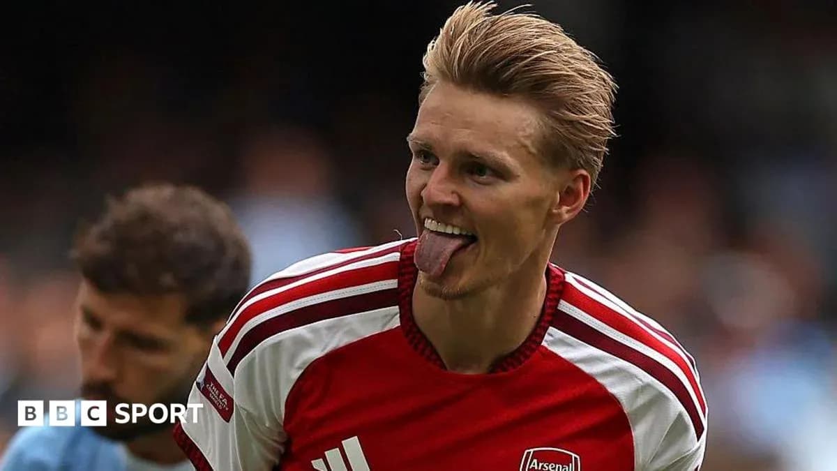 Arsenal player celebrating with tongue out
