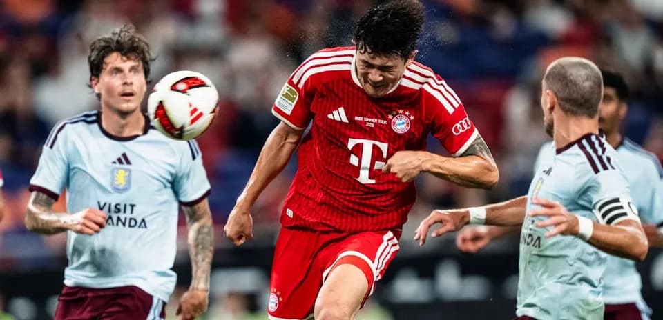 Player heading the ball during a competitive match
