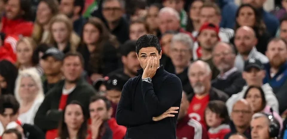 Manager observing the match with focused expression