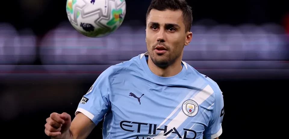 Player in light blue jersey controlling a soccer ball