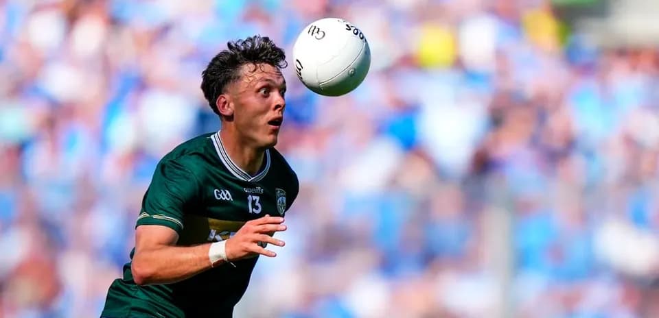 Player catching a football during a match