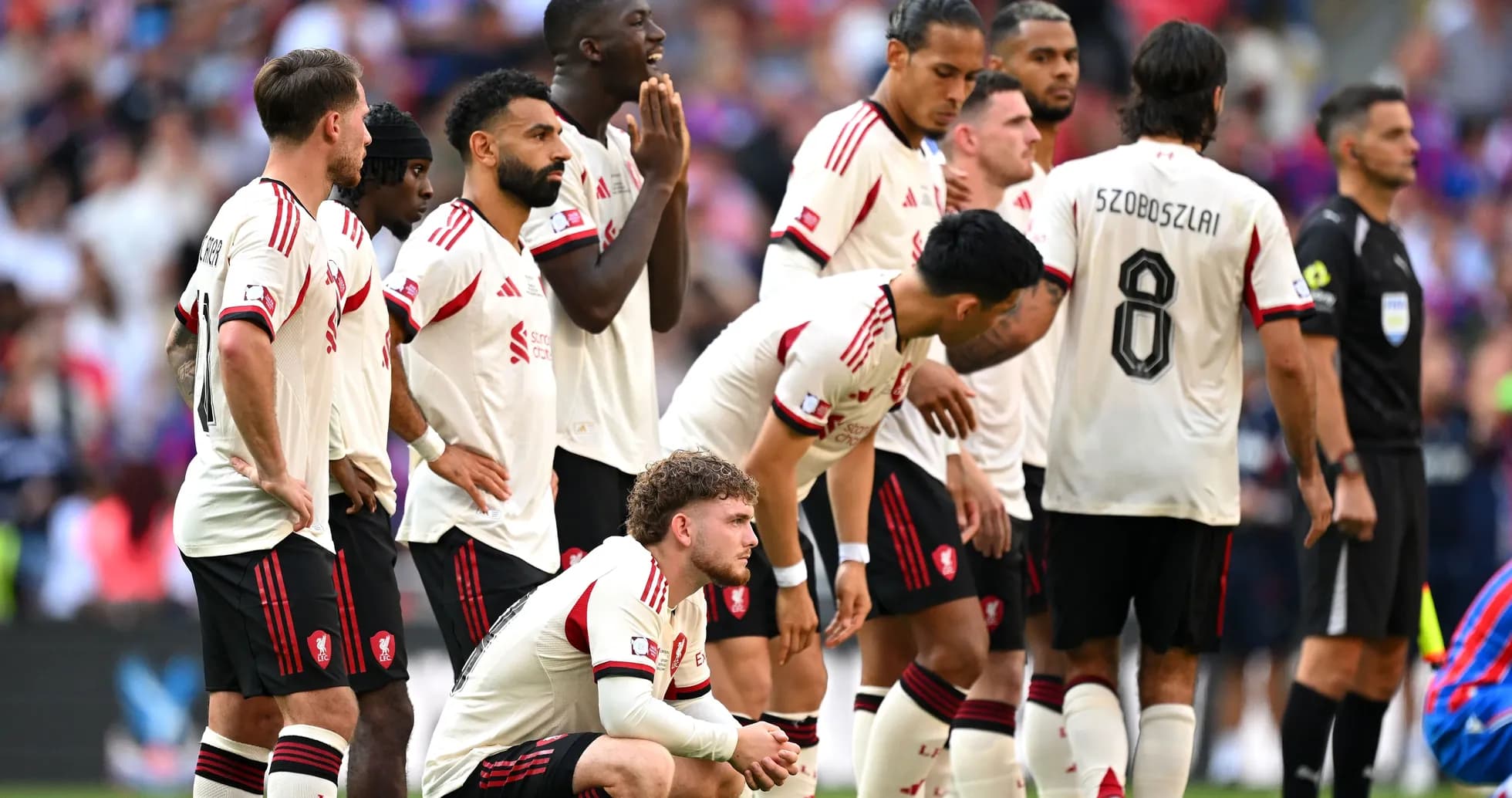Players from Liverpool FC in a defensive wall