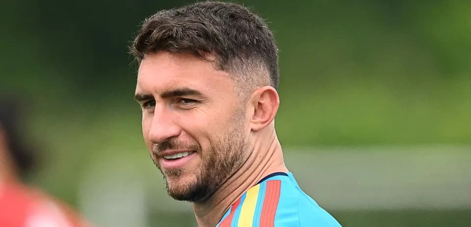 Player in training jersey smiling outdoors