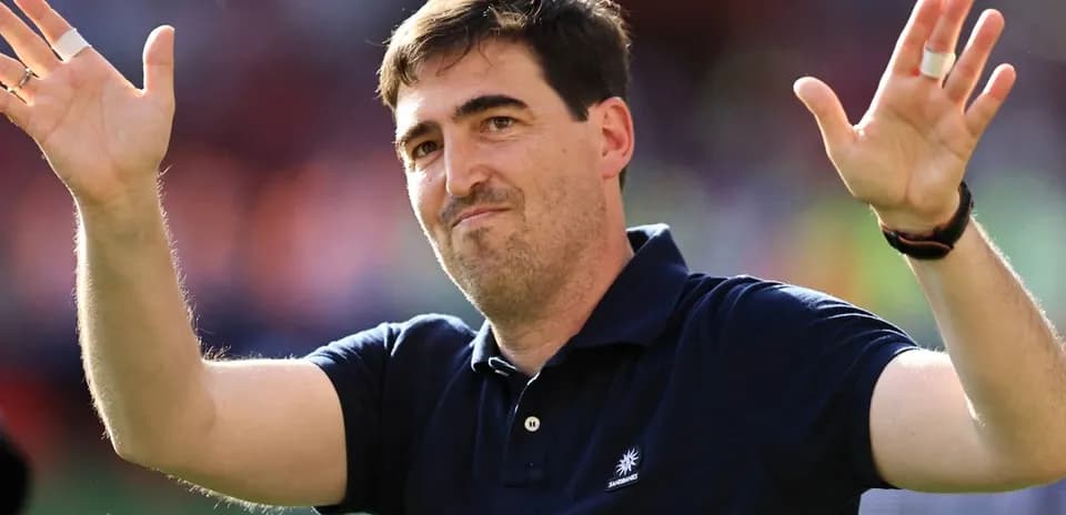 Person waving hands on the field after match