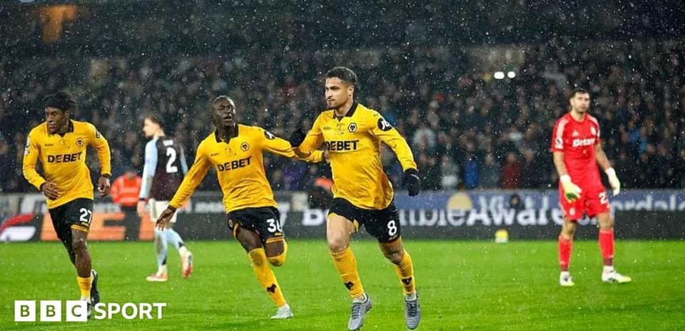 Player celebrating goal with teammates during match