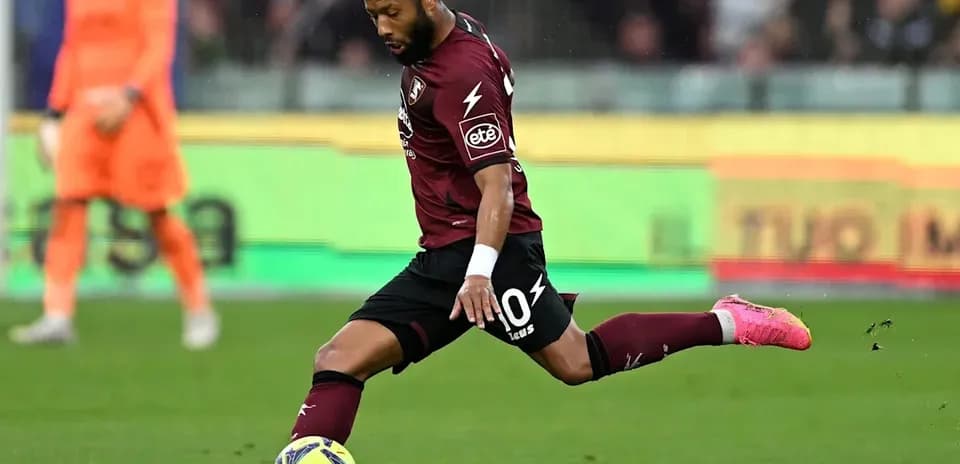 Player kicking ball during a football match