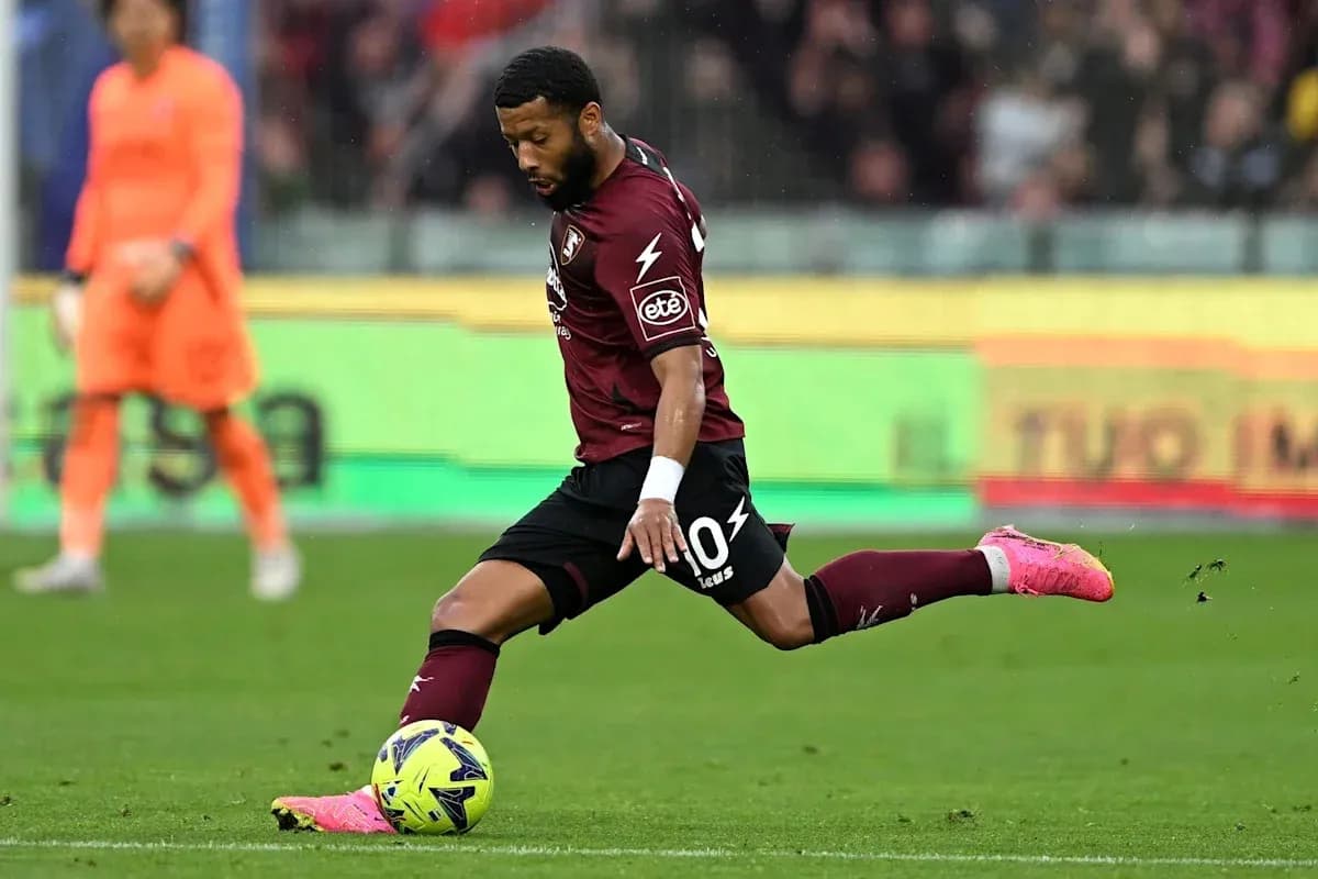 Player kicking ball during a football match