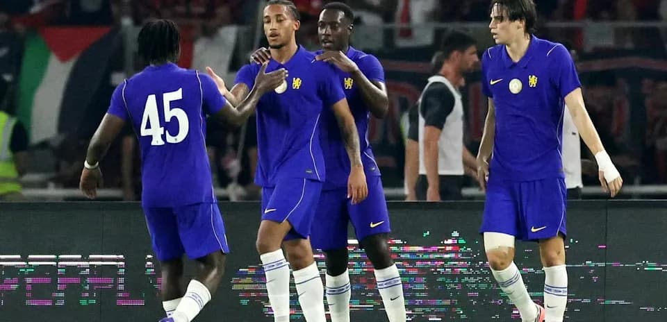 Players celebrating together on the pitch
