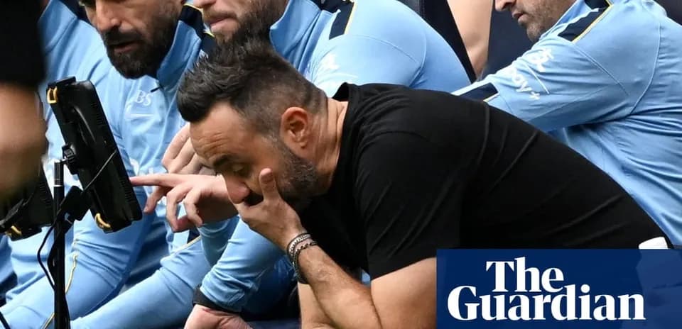 Coaching staff observing match on the bench