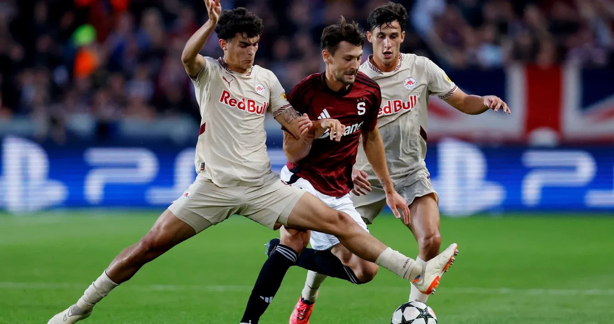 Red Bull Salzburg players tackling Sparta Praha player