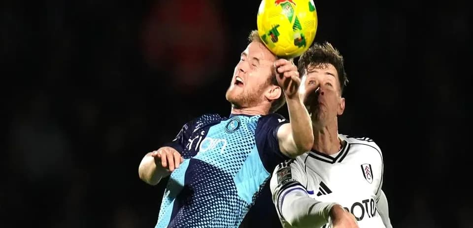 Two players competing for the ball during match