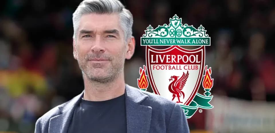 Man standing with Liverpool FC logo in background