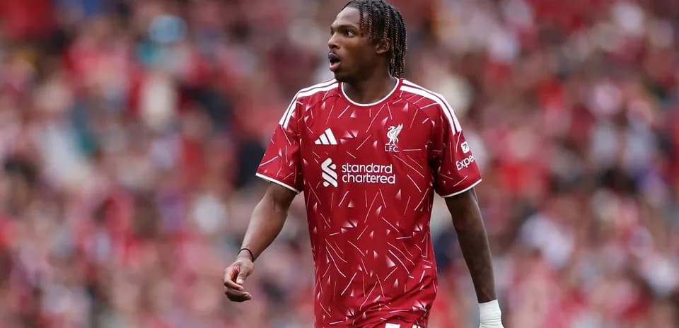Player in red Liverpool jersey on the pitch