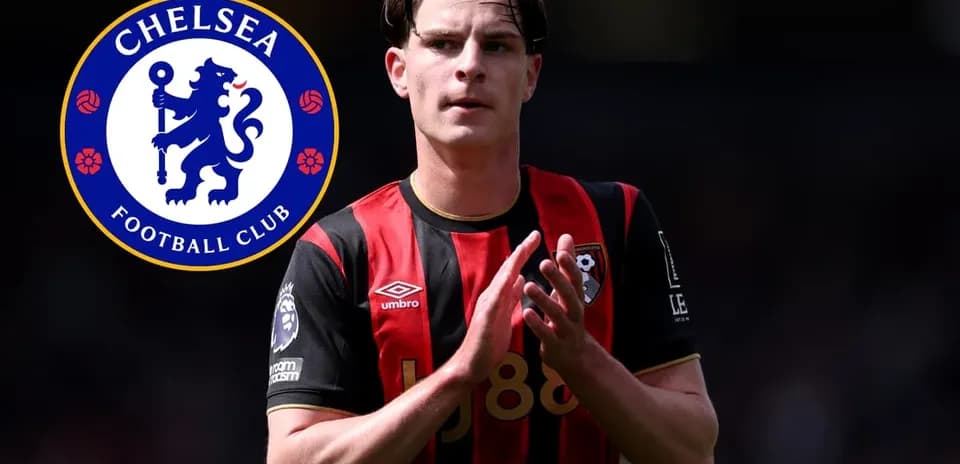 Player in Bournemouth kit with Chelsea logo background