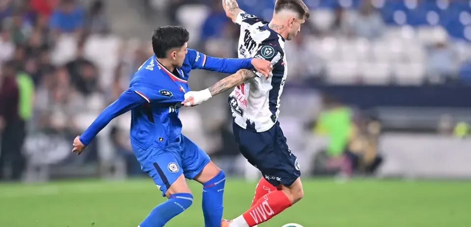 Monterrey player challenged by Cruz Azul opponent