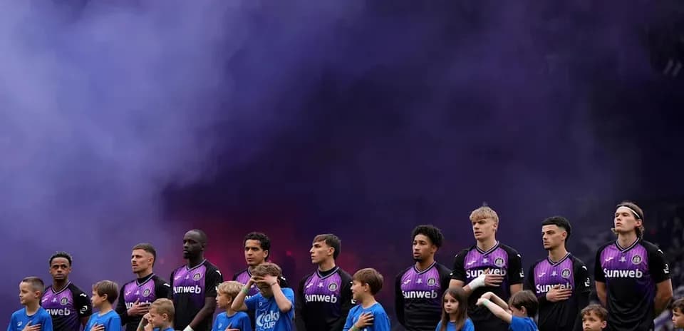Players and children standing for the national anthem