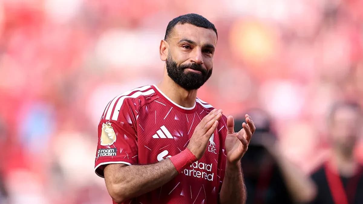 Player applauding fans in Liverpool kit