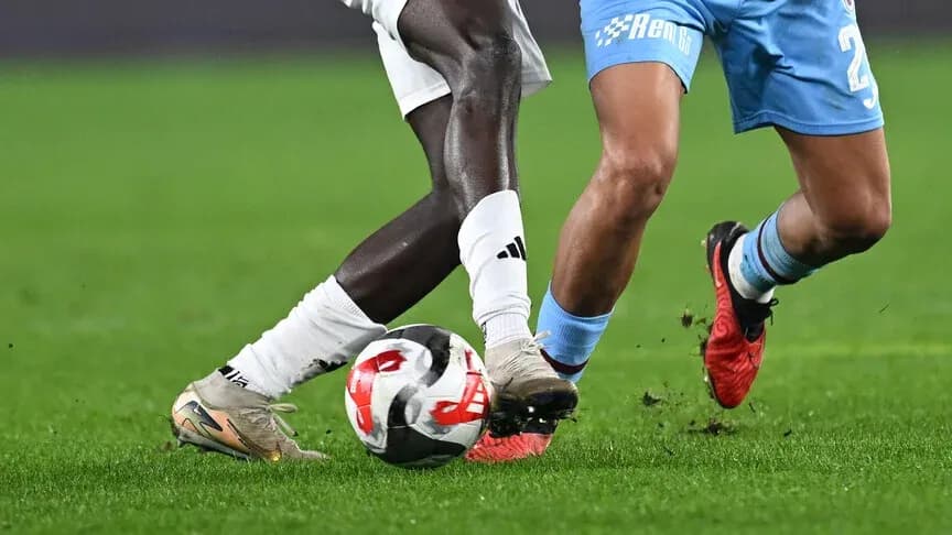 Two players challenging for the ball during match