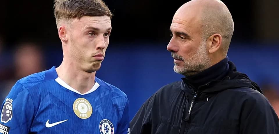 Two football players discussing on the pitch