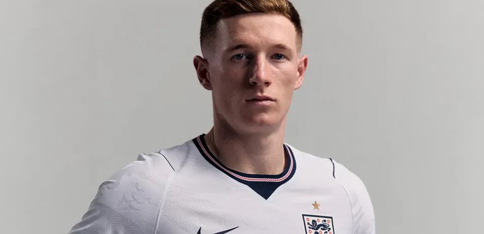 Player posing in England football kit