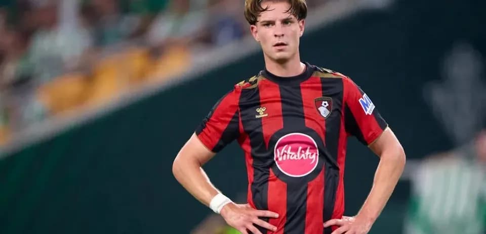 Player in Bournemouth kit on the pitch