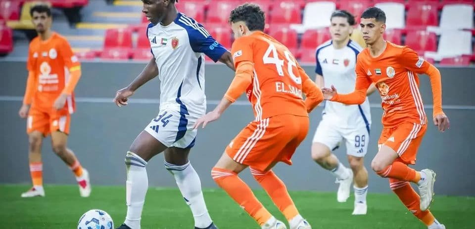 Dibba Al Fujairah U23 player dribbling past opponents