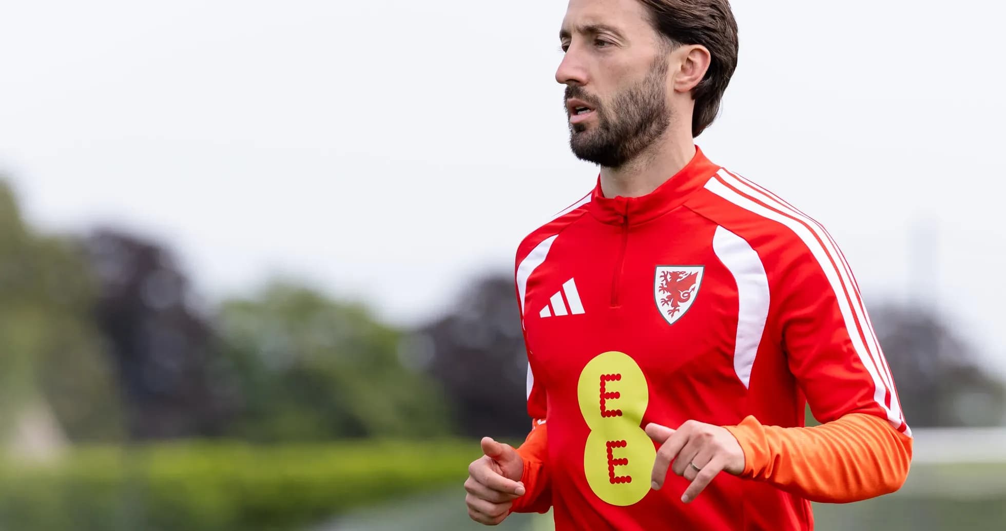 Player running during training session in red kit