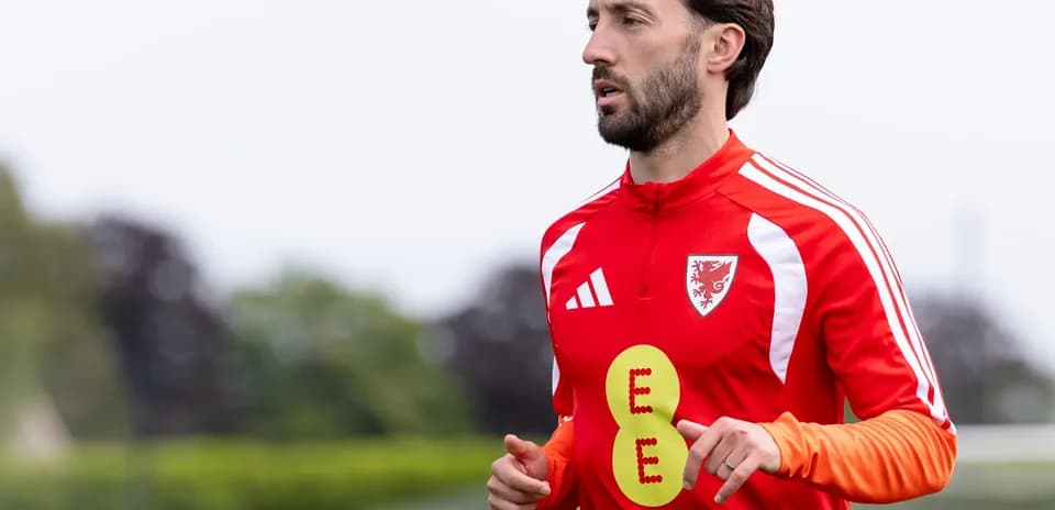 Player running during training session in red kit