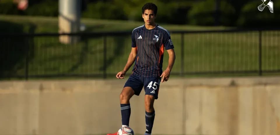 Player preparing to kick ball during match