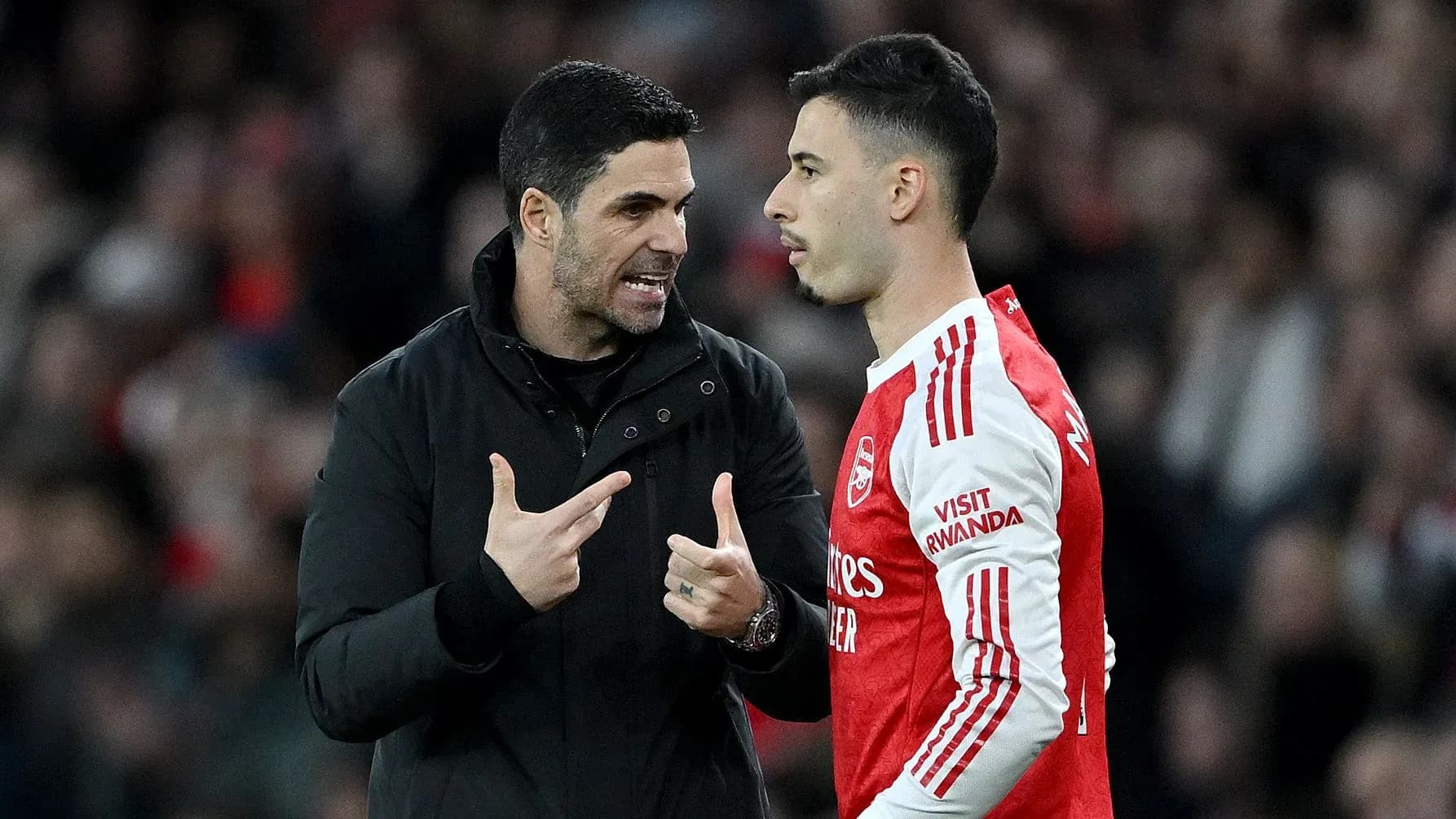 Manager speaking to player during match discussion