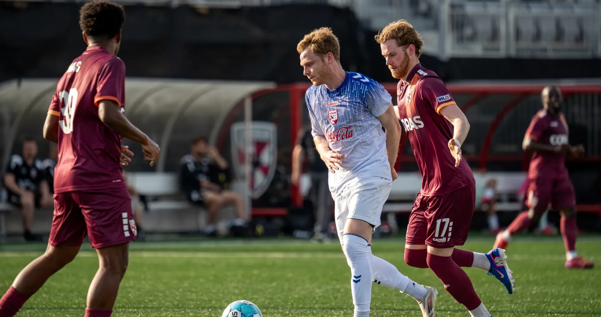 Players competing for the ball in USL Championship