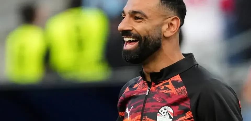 Player smiling during warm-up session on field