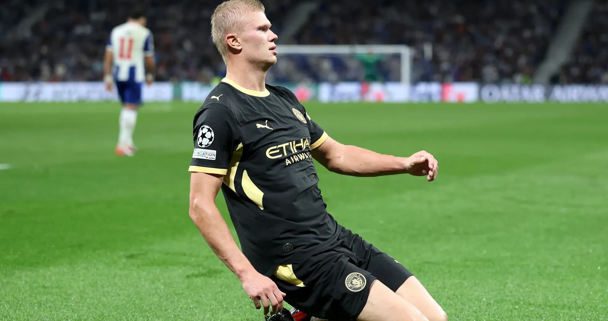 Player sliding on the pitch during match action