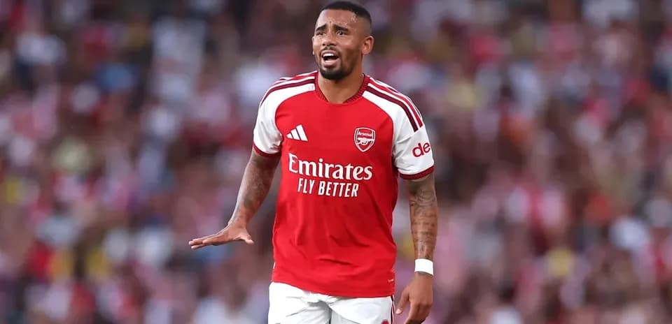 Player in Arsenal kit gesturing during match