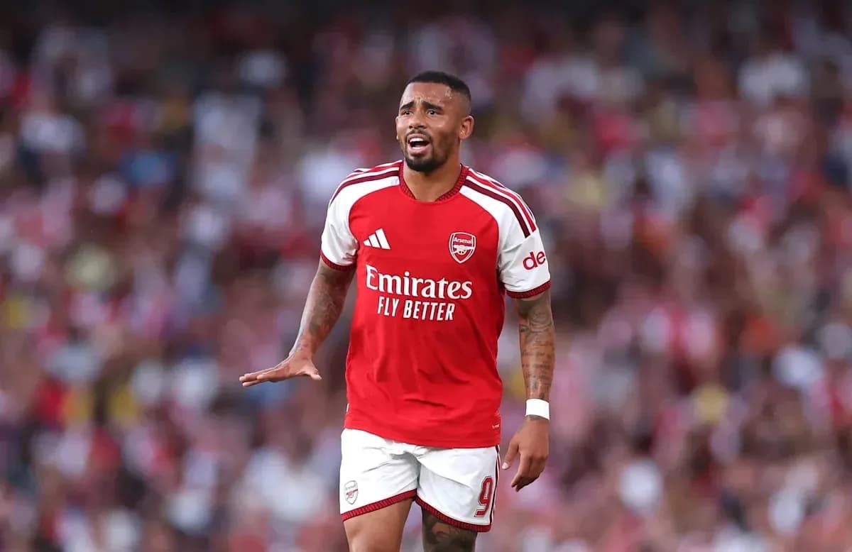 Player in Arsenal kit gesturing during match