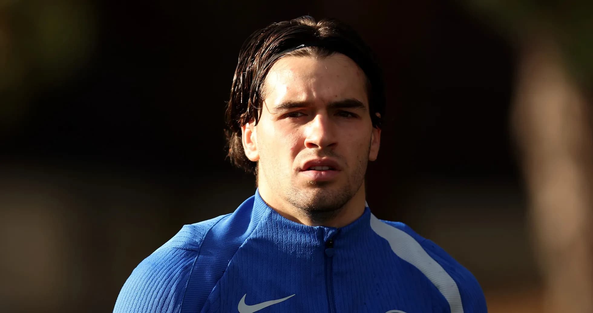 Player in blue training kit looking forward