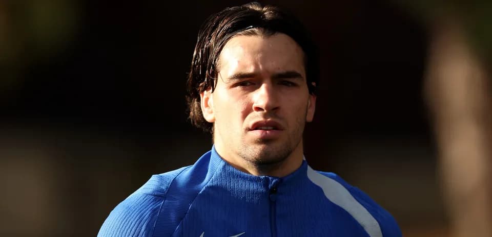 Player in blue training kit looking forward