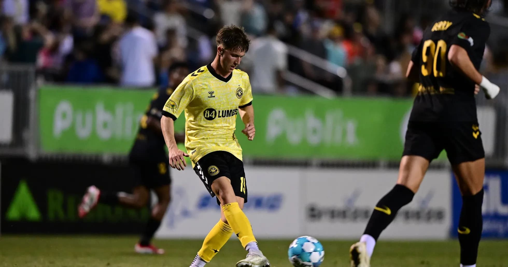 Player dribbling the ball during Charleston Battery match