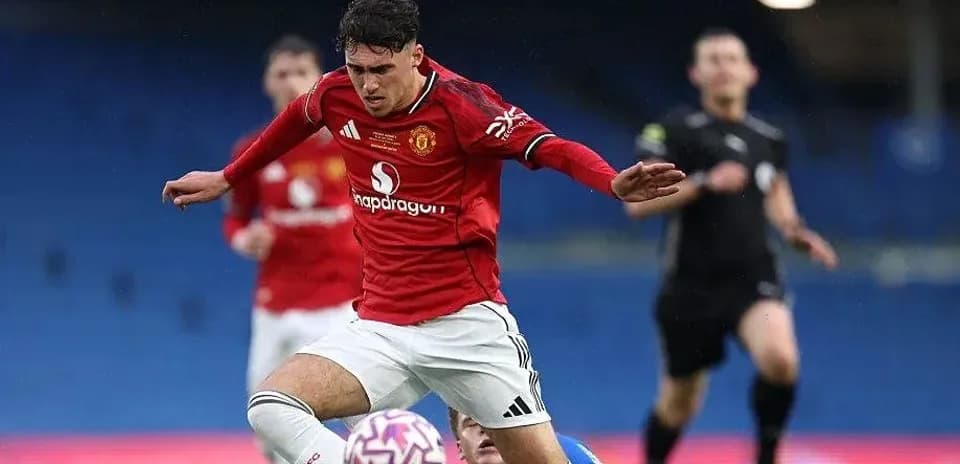 Player in red jersey falls during match action