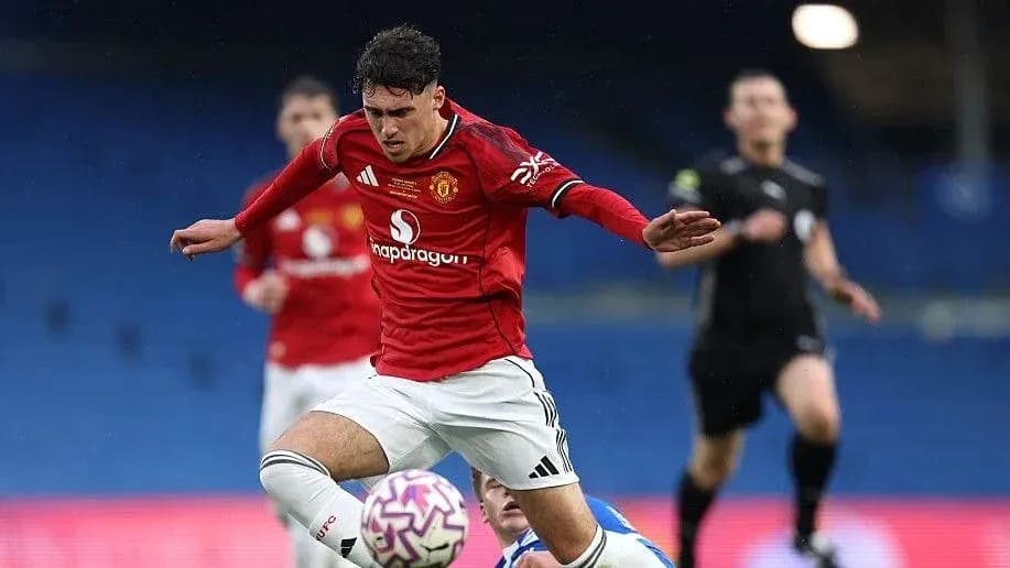 Player in red jersey falls during match action
