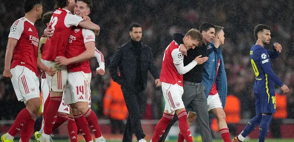 Arsenal players celebrating after match victory