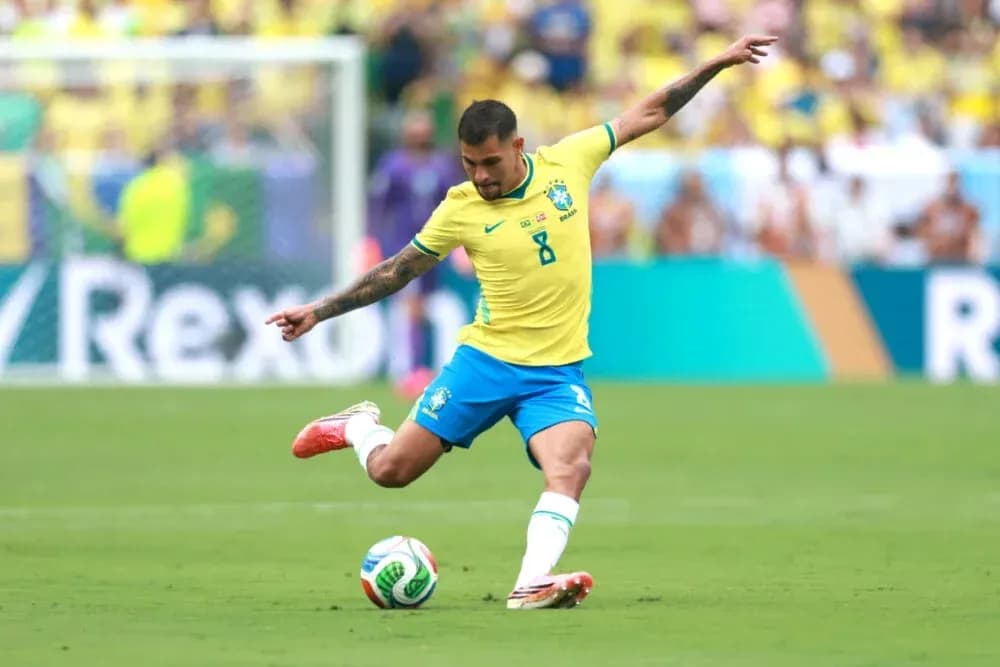 Brazilian player kicking soccer ball on field