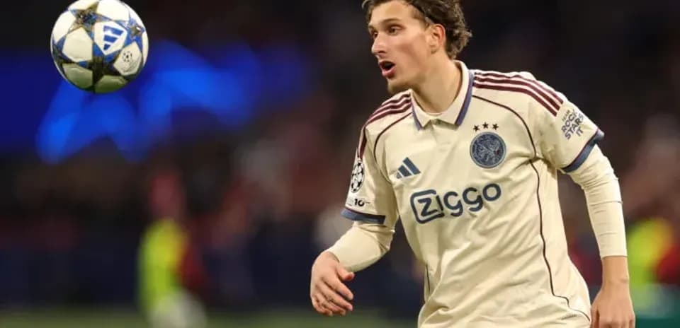 Player in Ajax kit tracking a high ball