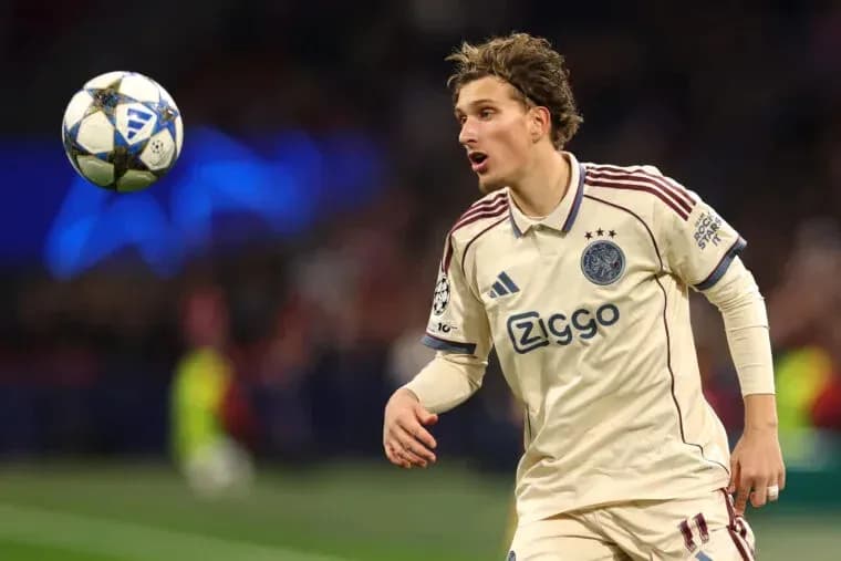Player in Ajax kit tracking a high ball