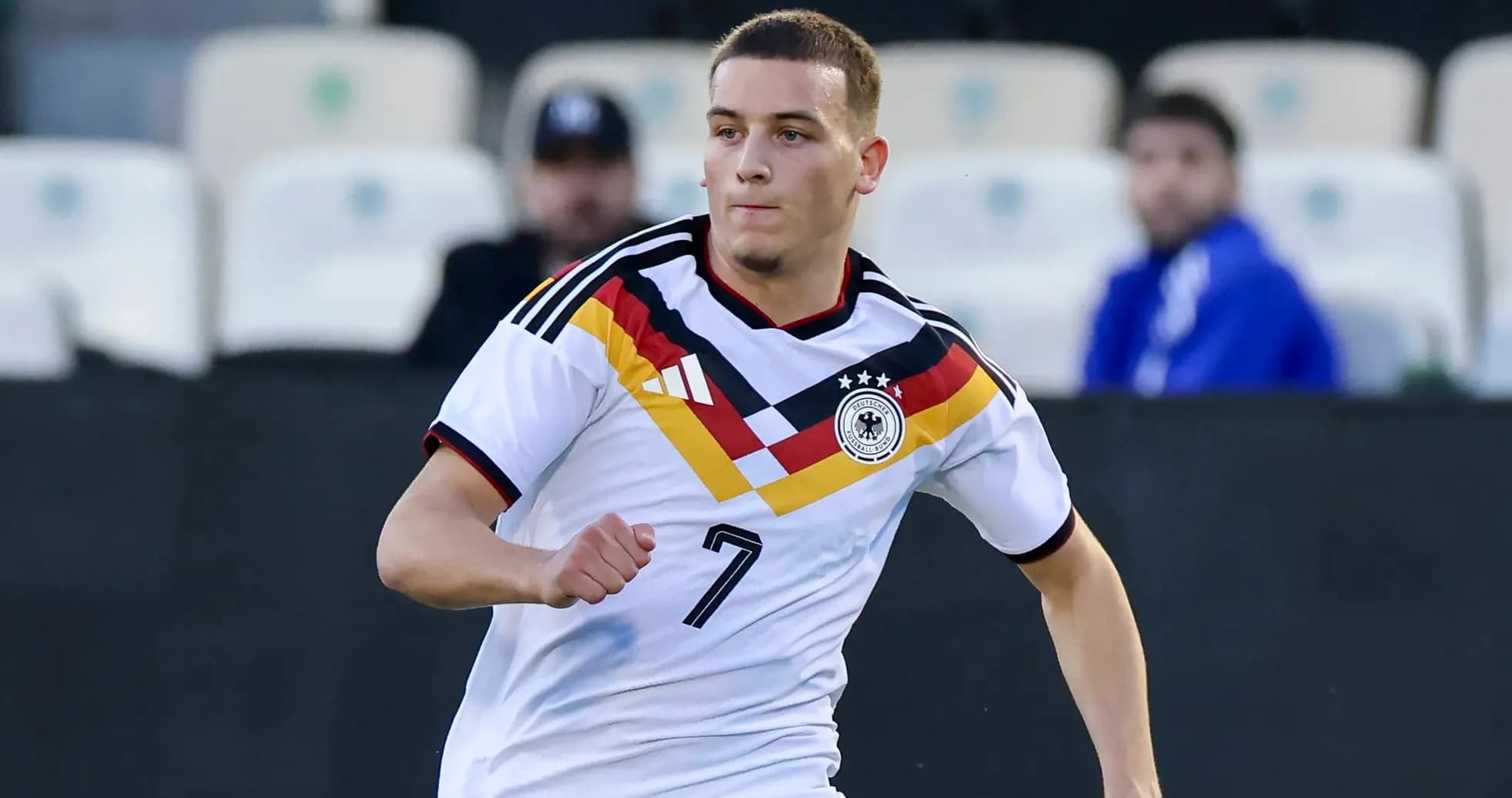 Player wearing Germany kit running on the field