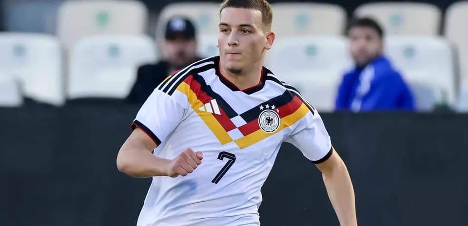 Player wearing Germany kit running on the field