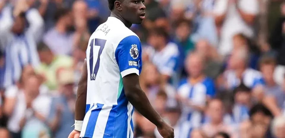 Player in Brighton kit on the field during match
