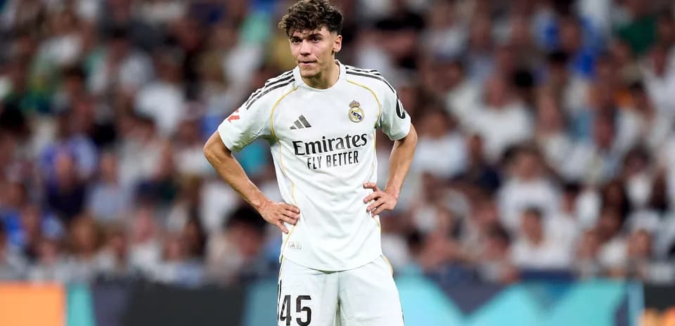 Player wearing Real Madrid kit on the field