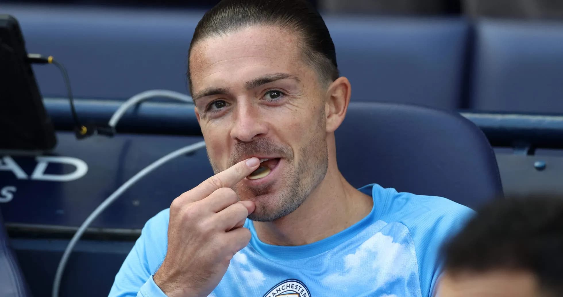 Player eating while seated on the bench